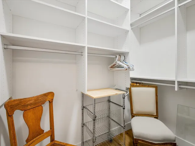 Spacious closet with wood finished floors