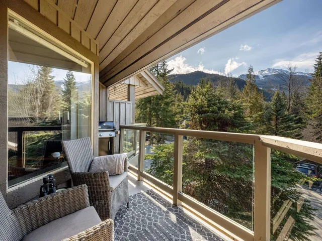 Balcony featuring grilling area and a mountain view
