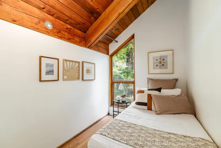 Vaulted wood-paneled ceiling with exposed beams