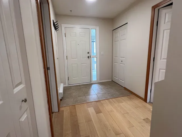 Entryway featuring light wood-style flooring and baseboards