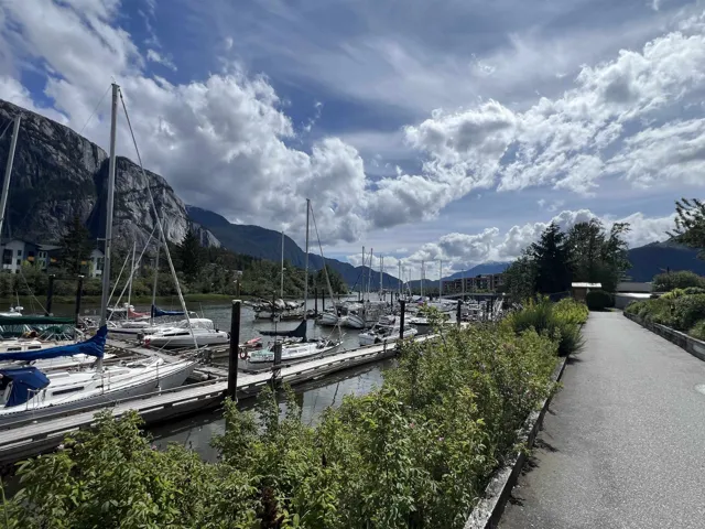 Dock featuring a water and mountain view