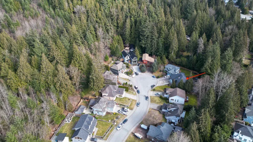 Aerial view with a forest view and a residential view
