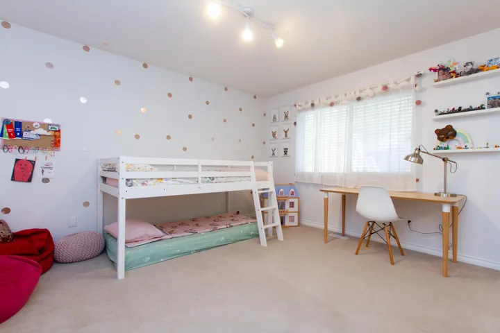 Carpeted bedroom featuring baseboards