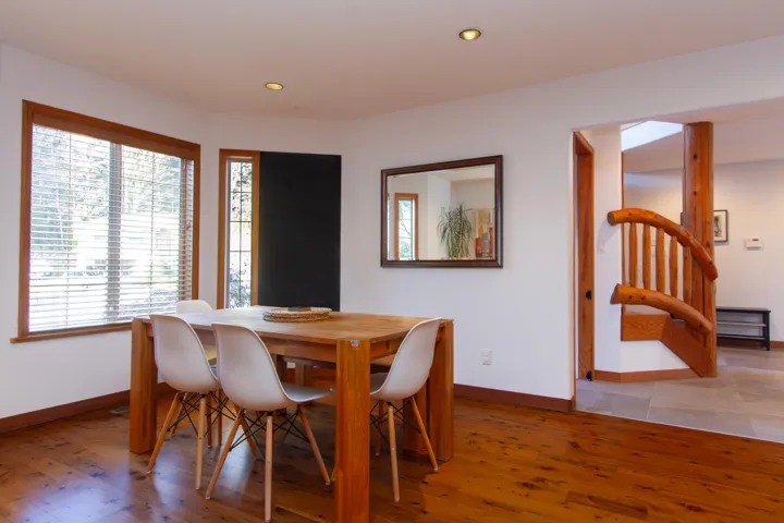 Dining room featuring light wood-style flooring, baseboards, and recessed lighting