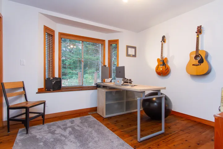 Home office featuring baseboards and hardwood / wood-style flooring
