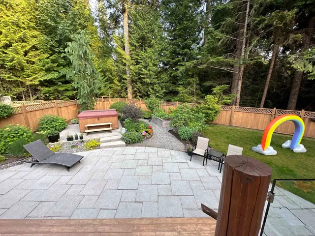 View of patio / terrace with a fenced backyard and a hot tub