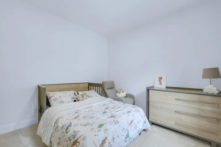 Bedroom with baseboards and carpet floors