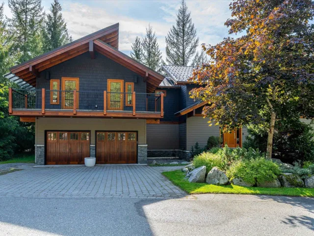 Contemporary architectural design featuring dark shingle siding and natural wood accents