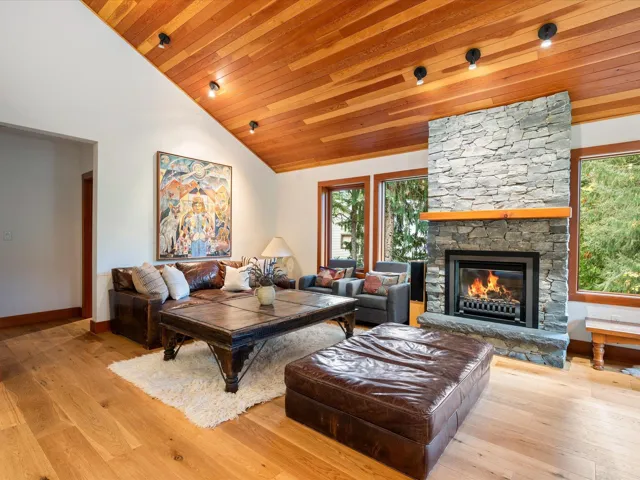 Vaulted wood-finish ceiling with recessed lighting
