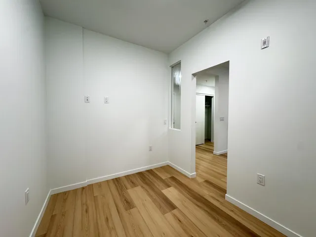 Unfurnished room featuring light wood-style flooring and baseboards