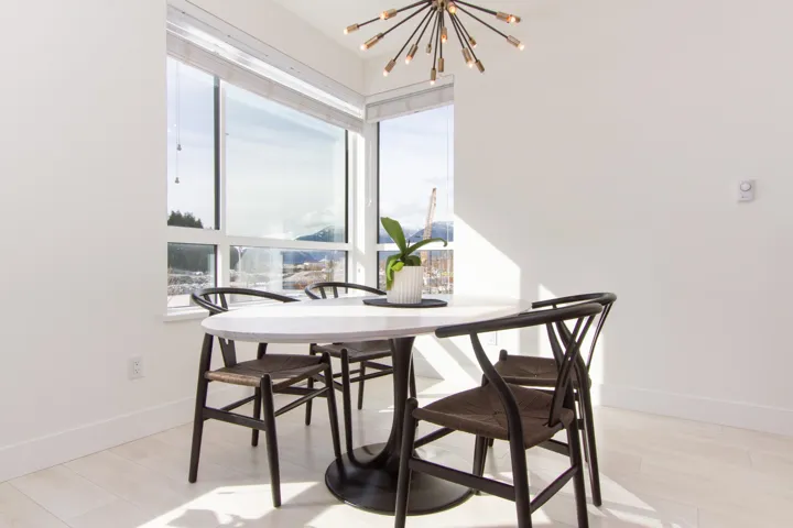 Dining space with baseboards and a notable chandelier