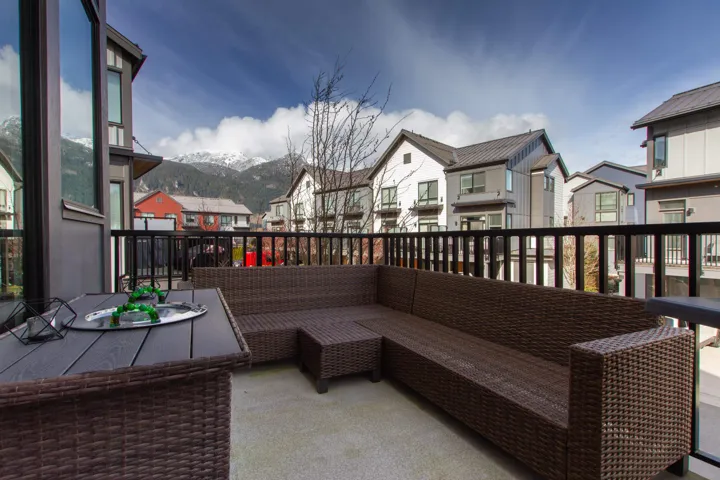 View of patio / terrace with a residential view, an outdoor living space, and a mountain view