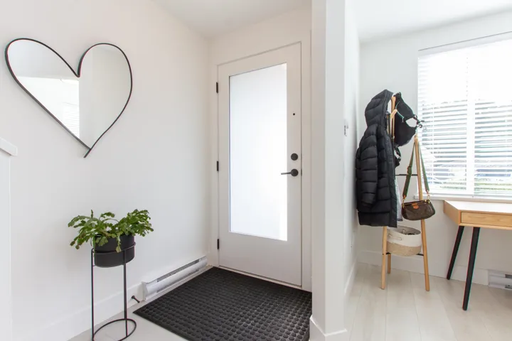 Doorway with baseboards and a baseboard radiator