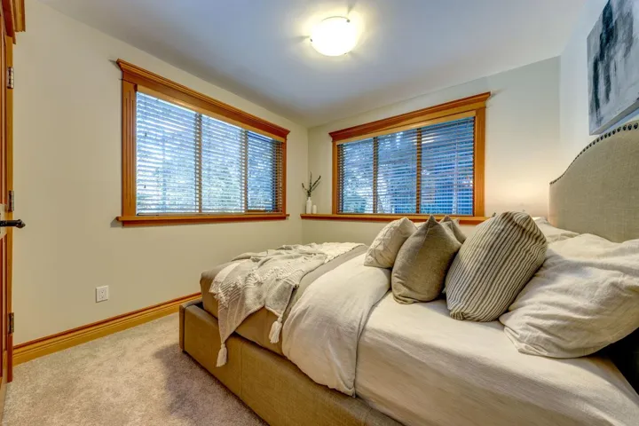 Carpeted bedroom featuring baseboards