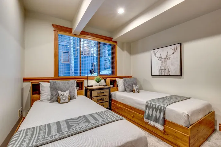 Bedroom with beam ceiling and recessed lighting