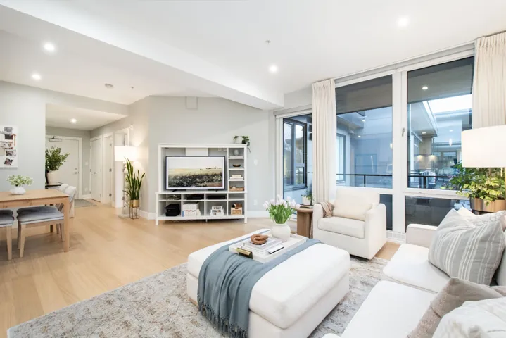 Living room with recessed lighting, baseboards, and light wood finished floors