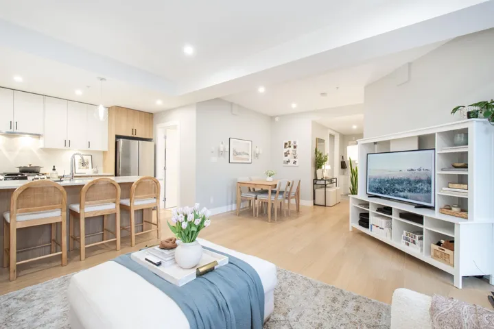 Living room with recessed lighting, baseboards, and light wood finished floors