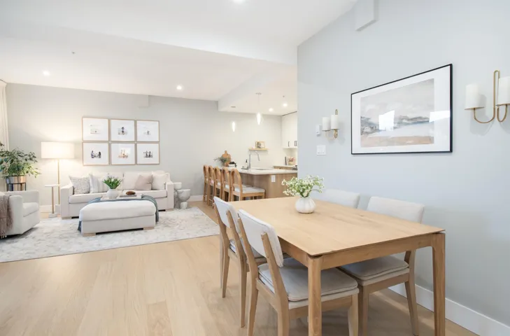 Dining area featuring light wood finished floors, baseboards, and recessed lighting