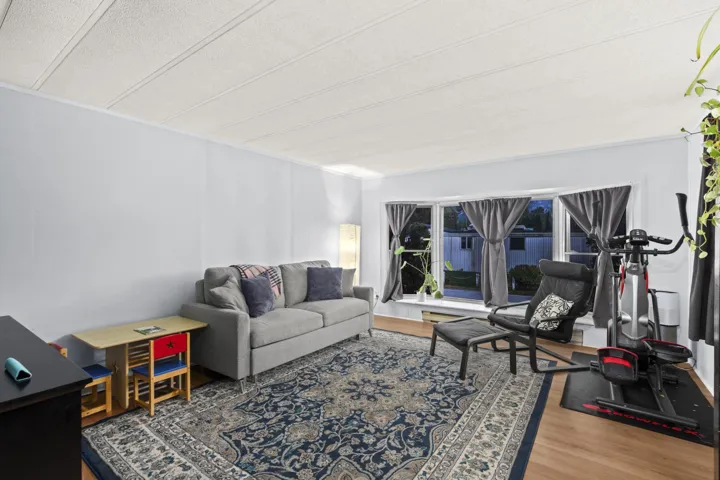 Living area with light wood-type flooring