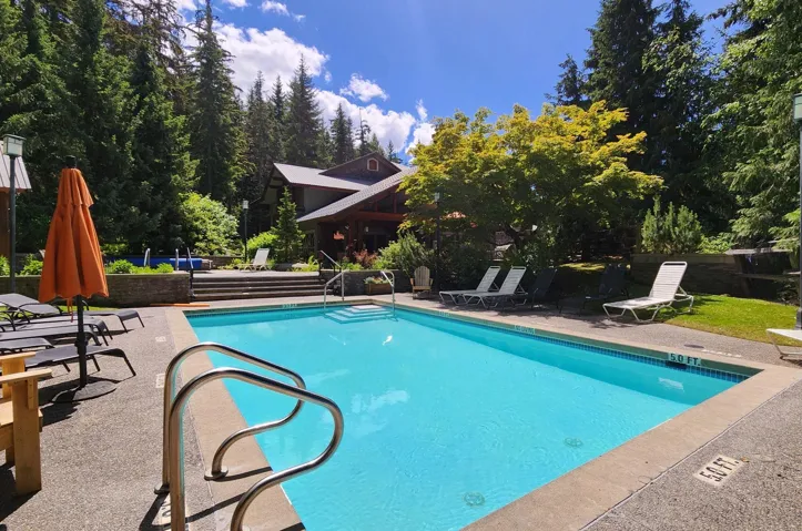 Community pool featuring a patio area