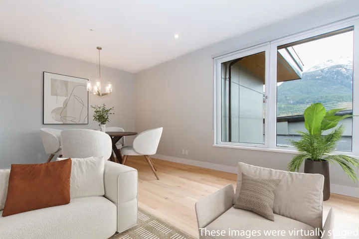 Dining room with baseboards, light wood-type flooring, a chandelier, and recessed lighting