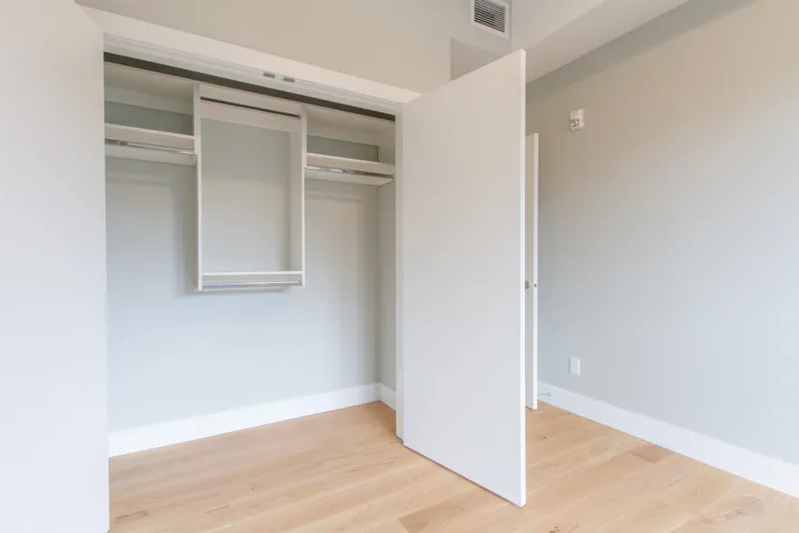 Closet featuring built in shelving