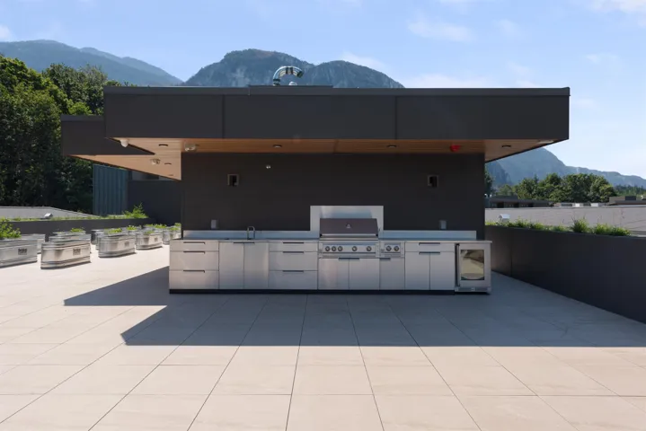 View of patio / terrace featuring a mountain view and an outdoor kitchen