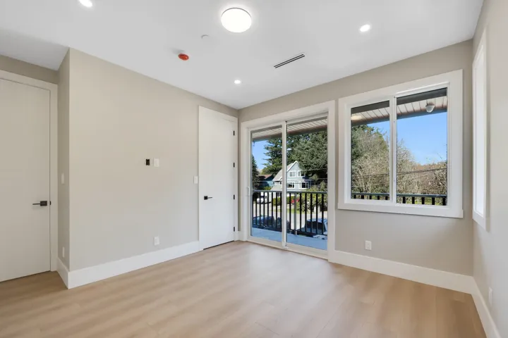 Spare room featuring healthy amount of natural light, light wood-type flooring, and recessed lighting