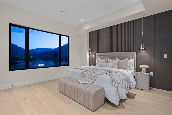 Bedroom featuring a mountain view, wood finished floors, and recessed lighting