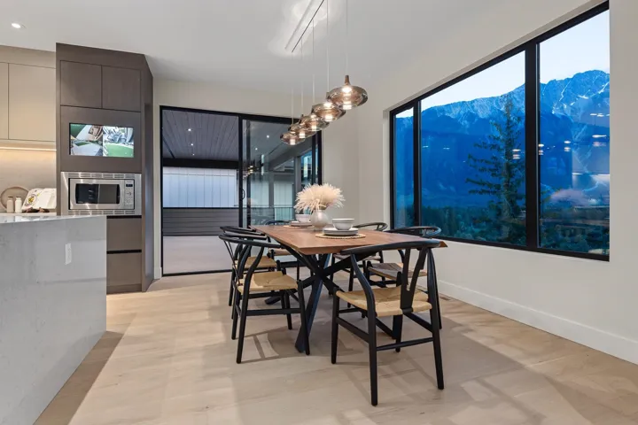 Dining room featuring a mountain view and light wood-style flooring