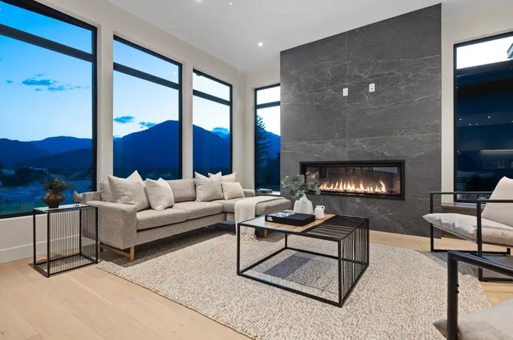 Living room featuring a mountain view, wood finished floors, and a premium fireplace