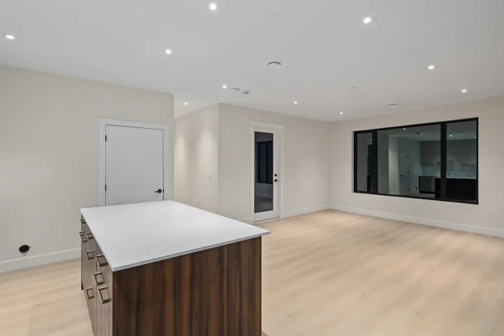Spare room featuring light wood-type flooring and recessed lighting
