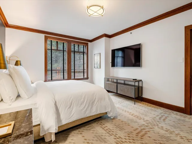 Bedroom featuring carpet flooring, baseboards, and crown molding