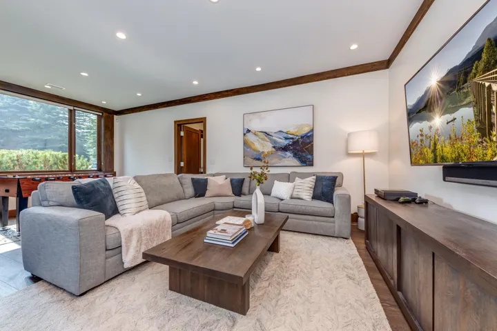 Living area featuring recessed lighting and ornamental molding