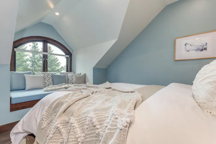 Bedroom with lofted ceiling and recessed lighting