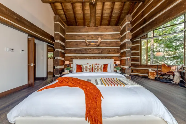 Bedroom featuring dark wood-style flooring and wood ceiling