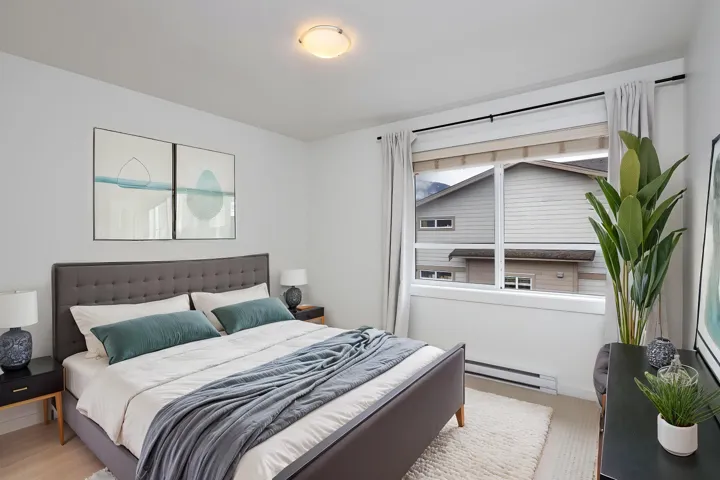 Bedroom featuring a baseboard heating unit