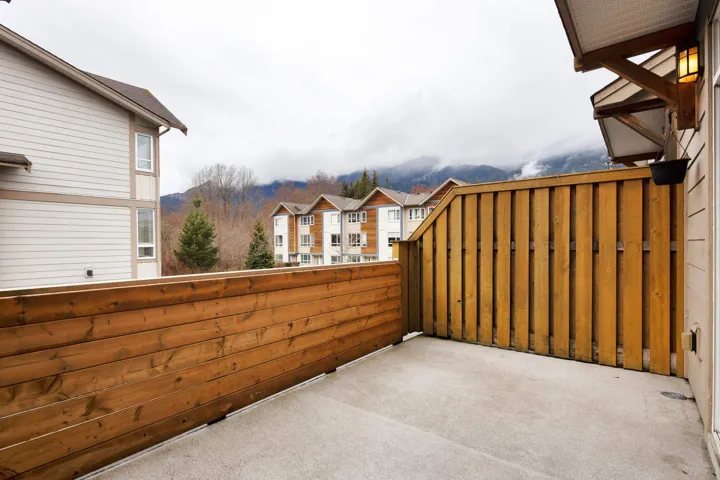 View of patio with a balcony and a residential view