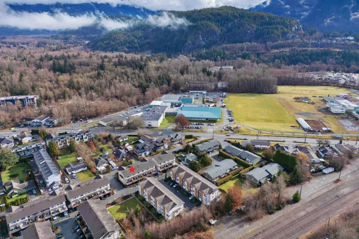 Birds eye view of property featuring a view of trees