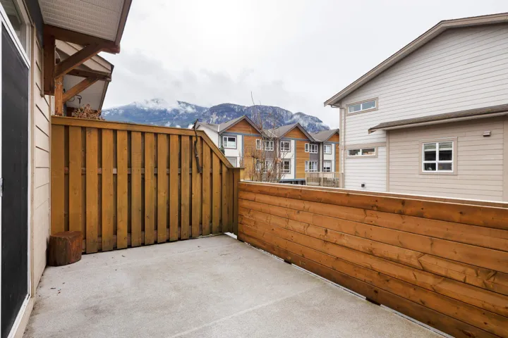 View of patio / terrace featuring a residential view, a mountain view, and a balcony