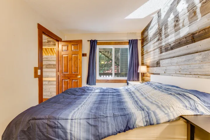 Bedroom with wood walls