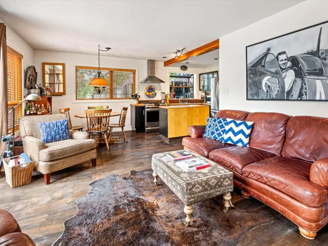 Living room featuring dark wood-style floors
