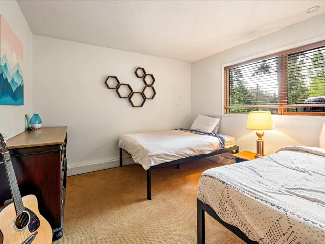 Carpeted bedroom featuring baseboards
