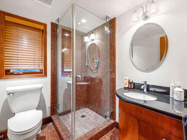 Bathroom featuring vanity and a stall shower