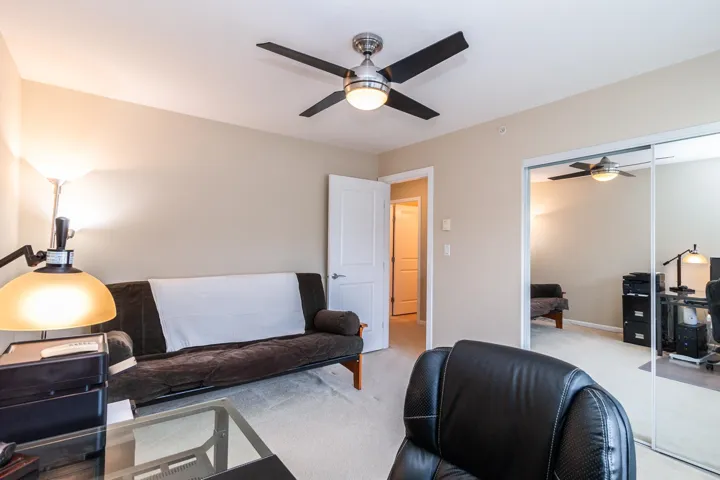 Office space with carpet flooring and ceiling fan