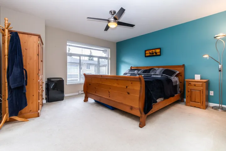 Bedroom featuring carpet and ceiling fan