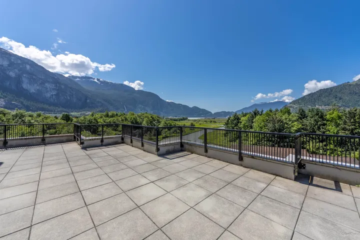 View of patio featuring a mountain view and a balcony