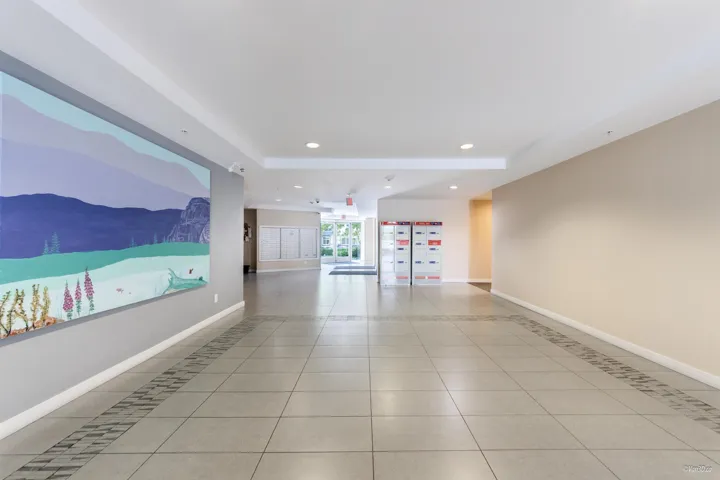 Unfurnished room featuring light tile patterned floors, recessed lighting, baseboards, and a tray ceiling