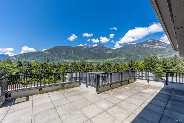 View of patio / terrace with a mountain view and a balcony
