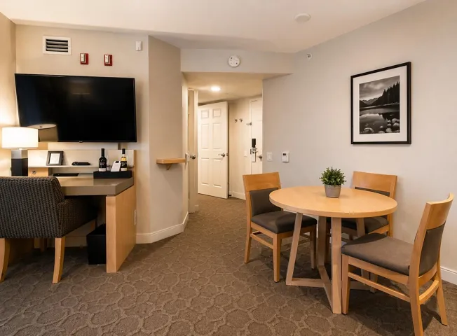 Open-plan room featuring patterned carpeting and neutral-toned walls